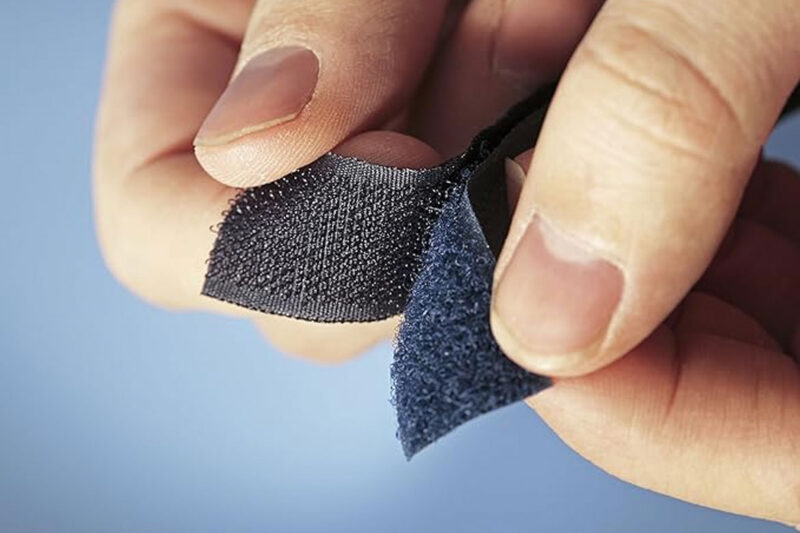Two Velcro pieces being pulled apart